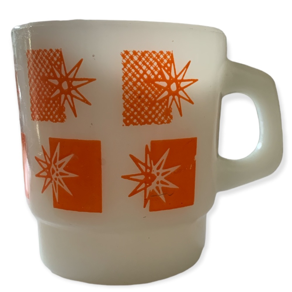 Vintage Fire King Atomic Starburst pattern in orange